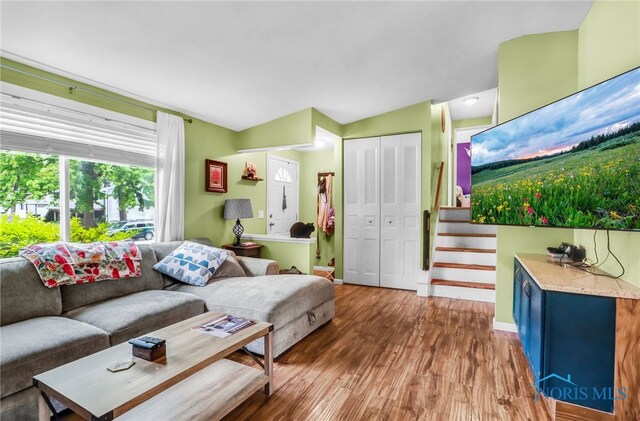 5956 E Pembridge Dr, Toledo, OH 43615 - living room featuring wood finished floors, baseboards, and stairs