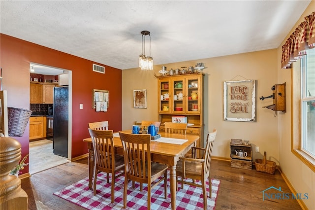 8012 County Highway 55, Upper Sandusky, OH 43351 - dining space with hardwood / wood-style flooring and baseboards