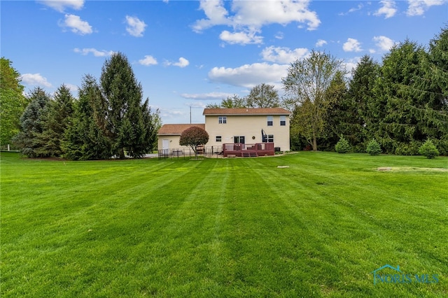 8012 County Highway 55, Upper Sandusky, OH 43351 - back of property with a lawn and a deck