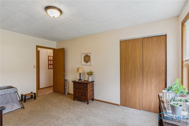 8012 County Highway 55, Upper Sandusky, OH 43351 - bedroom with light colored carpet, a textured ceiling, a closet, and baseboards