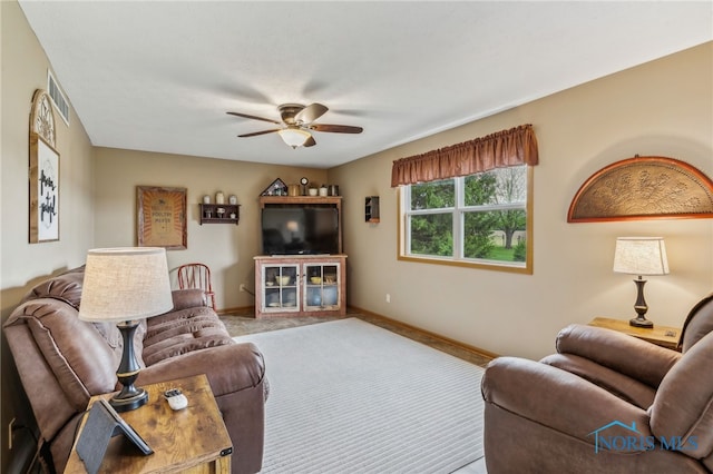 8012 County Highway 55, Upper Sandusky, OH 43351 - carpeted living room featuring a ceiling fan and baseboards