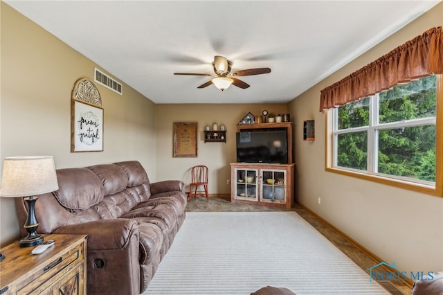 8012 County Highway 55, Upper Sandusky, OH 43351 - carpeted living room with ceiling fan and baseboards