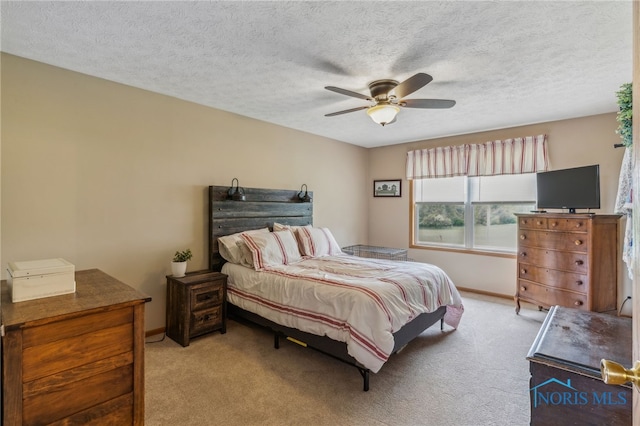 8012 County Highway 55, Upper Sandusky, OH 43351 - bedroom featuring light carpet, baseboards, ceiling fan, and a textured ceiling