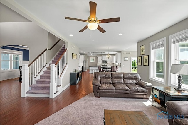9575 Newbury Ln, Whitehouse, OH 43571 - living room with wood-type flooring, stairs, a ceiling fan, recessed lighting, and arched walkways