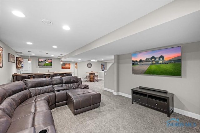 9575 Newbury Ln, Whitehouse, OH 43571 - living area featuring bar with sink, recessed lighting, carpet flooring, and baseboards