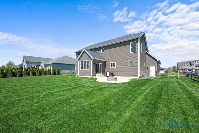 9575 Newbury Ln, Whitehouse, OH 43571 - rear view of property featuring cooling unit, a patio, and an outdoor fire pit