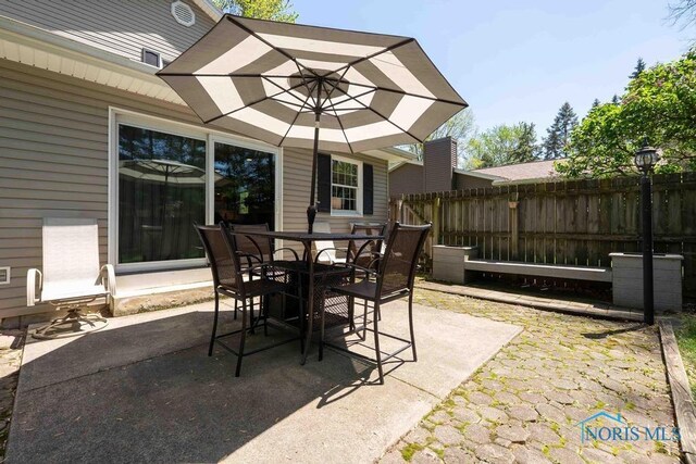 2057 Windsor Pl, Findlay, OH 45840 - view of patio with fence and outdoor dining space