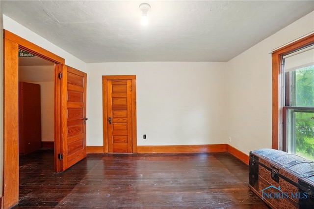 7438 Yawberg Rd, Whitehouse, OH 43571 - unfurnished room with wood-type flooring, healthy amount of natural light, and baseboards