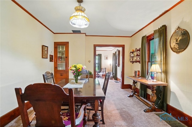 7438 Yawberg Rd, Whitehouse, OH 43571 - carpeted dining space with ornamental molding and baseboards