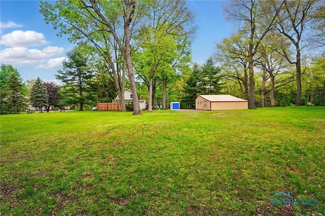 7438 Yawberg Rd, Whitehouse, OH 43571 - view of grassy yard featuring an outdoor structure