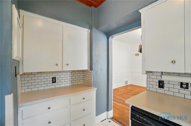 4315 Eastway St, Toledo, OH 43612 - kitchen with dishwasher, light countertops, decorative backsplash, and white cabinetry