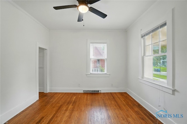 4315 Eastway St, Toledo, OH 43612 - empty room with ornamental molding, wood finished floors, baseboards, and a ceiling fan