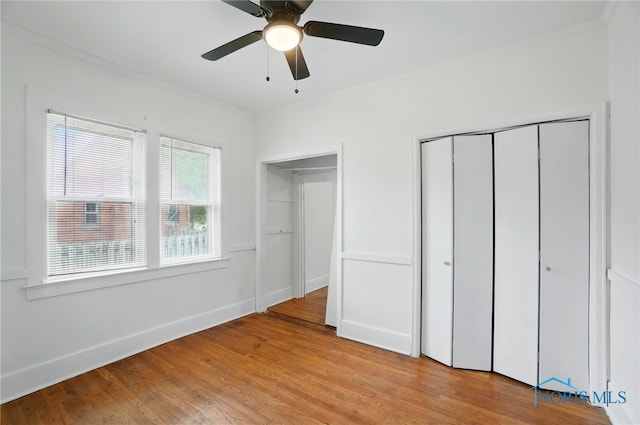 4315 Eastway St, Toledo, OH 43612 - unfurnished bedroom featuring light wood finished floors, a closet, baseboards, ceiling fan, and crown molding