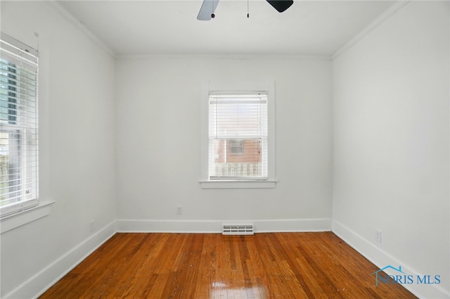 4315 Eastway St, Toledo, OH 43612 - unfurnished room featuring wood-type flooring, ornamental molding, ceiling fan, and baseboards
