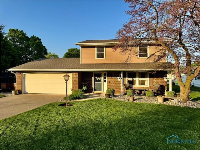 203 Oak Park Dr, Hicksville, OH 43526 - traditional home with a garage, concrete driveway, a front yard, brick siding, and roof with shingles
