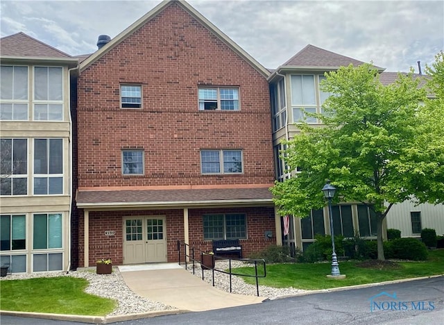 4730 Glendale Ave Unit 206, Toledo, OH 43614 - view of building exterior with a garage and driveway