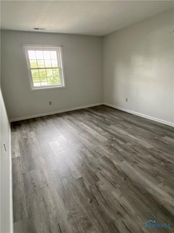 4730 Glendale Ave Unit 206, Toledo, OH 43614 - spare room with dark wood-type flooring and baseboards