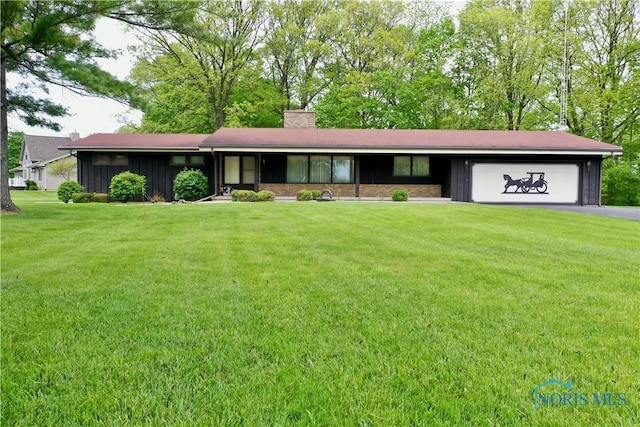 230 Orchard Ln, Upper Sandusky, OH 43351 - ranch-style house featuring board and batten siding, an attached garage, driveway, a chimney, and a front yard