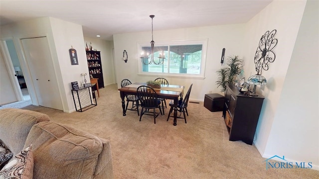 1875 State Route 101, Clyde, OH 43410 - dining area with carpet floors, a chandelier, and baseboards