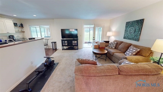 1875 State Route 101, Clyde, OH 43410 - carpeted living area featuring baseboards and recessed lighting
