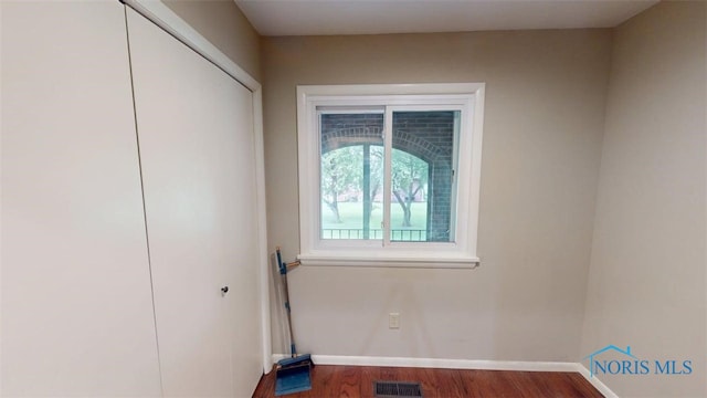 1875 State Route 101, Clyde, OH 43410 - spare room featuring baseboards and wood finished floors