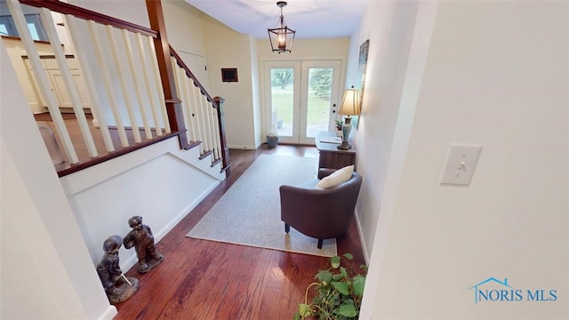 1875 State Route 101, Clyde, OH 43410 - foyer entrance featuring stairway, wood finished floors, baseboards, and french doors