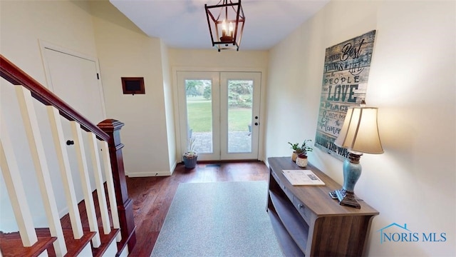 1875 State Route 101, Clyde, OH 43410 - entrance foyer featuring wood finished floors, stairway, and baseboards