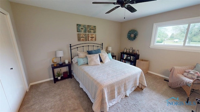 1875 State Route 101, Clyde, OH 43410 - bedroom with carpet, baseboards, and ceiling fan