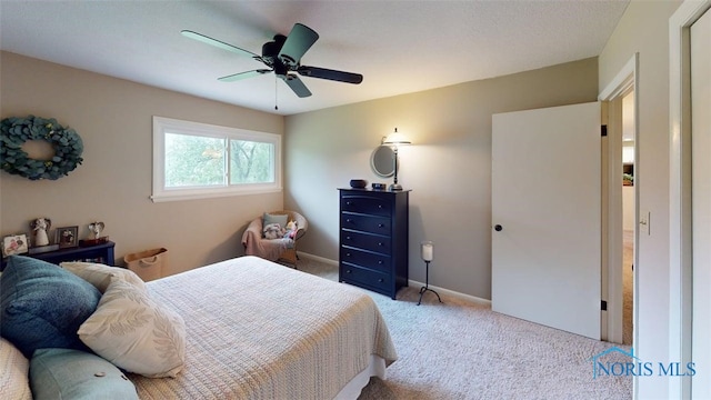 1875 State Route 101, Clyde, OH 43410 - bedroom with carpet floors, baseboards, and a ceiling fan