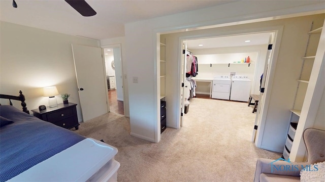 1875 State Route 101, Clyde, OH 43410 - bedroom with washer and dryer, light carpet, and ceiling fan