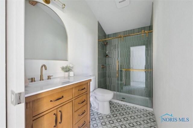 800 Pierce St, Maumee, OH 43537 - bathroom with a stall shower, toilet, vanity, and tile patterned flooring