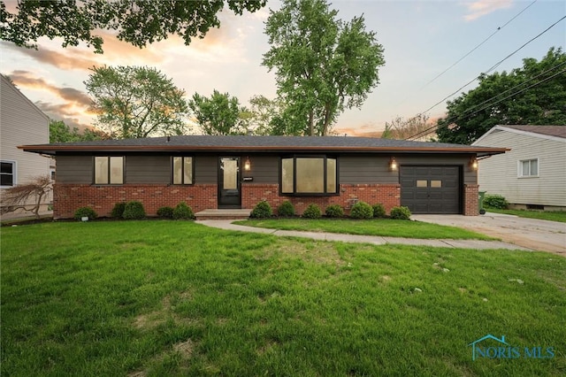 800 Pierce St, Maumee, OH 43537 - ranch-style home with brick siding, concrete driveway, and a yard