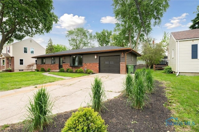 800 Pierce St, Maumee, OH 43537 - view of front of property featuring brick siding, concrete driveway, an attached garage, and a front yard