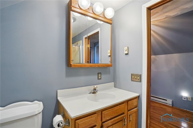 5450 Twp Rd 69, Tiffin, OH 44883 - bathroom with a baseboard heating unit, vanity, and toilet
