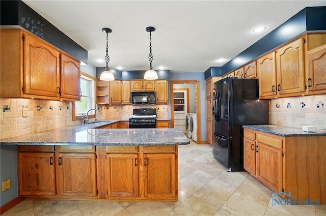 5450 Twp Rd 69, Tiffin, OH 44883 - kitchen featuring black appliances, a sink, a peninsula, stone countertops, and decorative backsplash