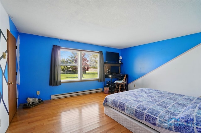 5450 Twp Rd 69, Tiffin, OH 44883 - bedroom featuring baseboard heating and wood finished floors