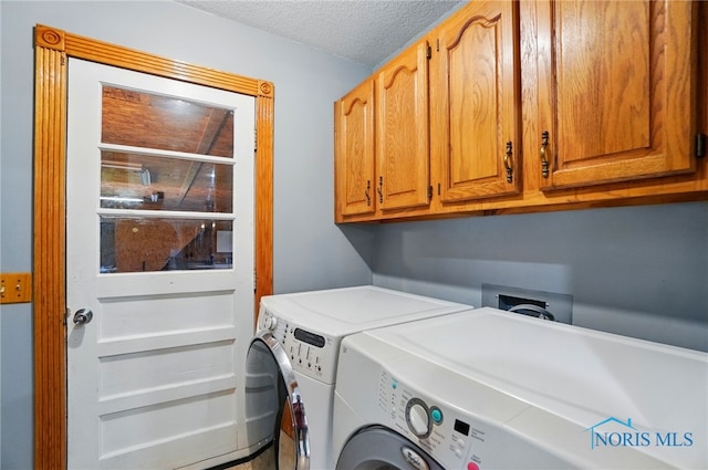 5450 Twp Rd 69, Tiffin, OH 44883 - clothes washing area featuring independent washer and dryer, cabinet space, and a textured ceiling
