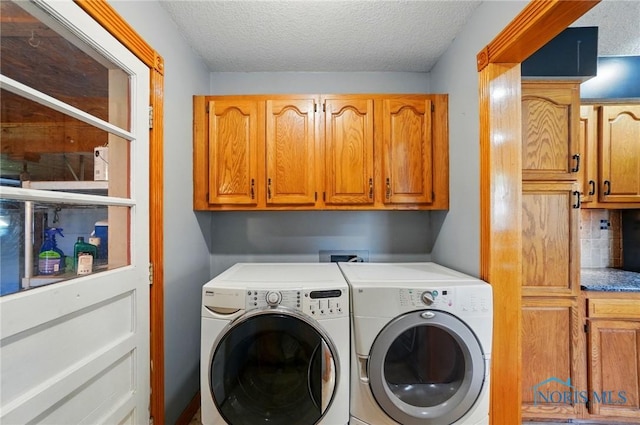 5450 Twp Rd 69, Tiffin, OH 44883 - washroom featuring washer and clothes dryer, cabinet space, and a textured ceiling