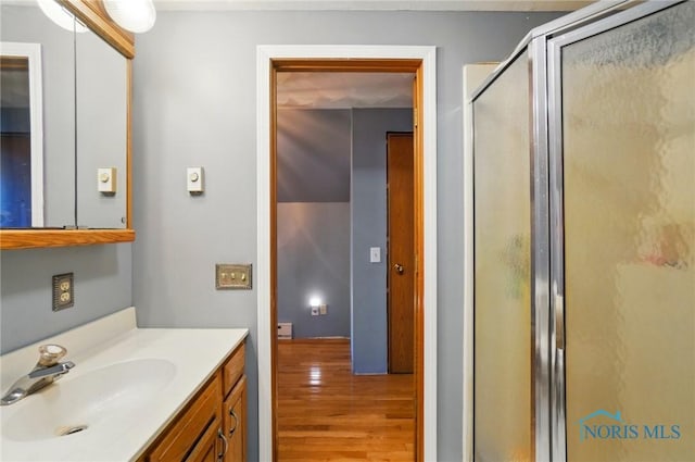 5450 Twp Rd 69, Tiffin, OH 44883 - full bath with wood finished floors, a stall shower, and vanity