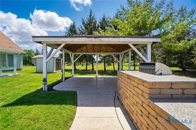 5450 Twp Rd 69, Tiffin, OH 44883 - view of home's community with a patio, an outdoor kitchen, a yard, an outdoor structure, and a gazebo