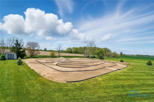 5450 Twp Rd 69, Tiffin, OH 44883 - view of community featuring a storage unit, a yard, and an outdoor structure