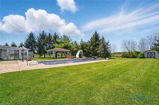 5450 Twp Rd 69, Tiffin, OH 44883 - view of green lawn featuring a gazebo, a shed, and an outdoor structure