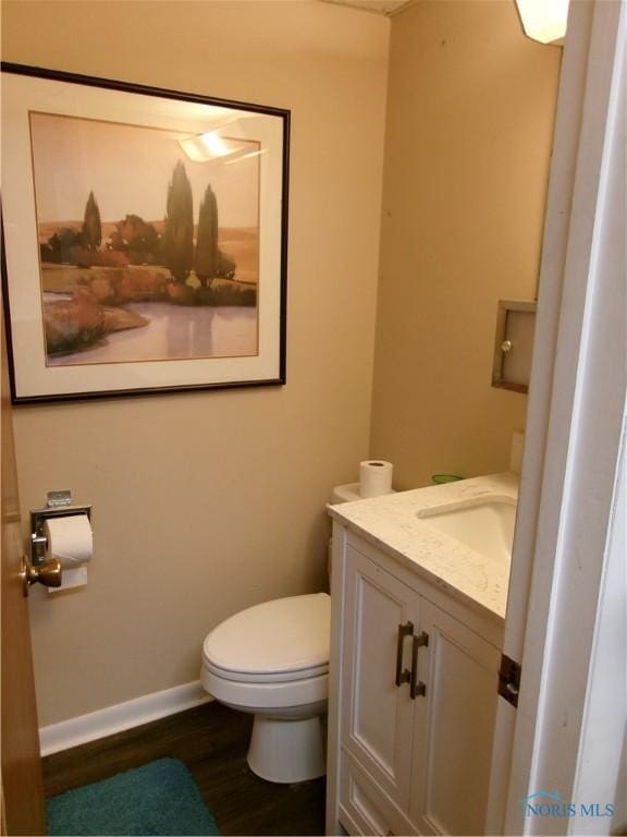 3776 Lakepointe Dr, Northwood, OH 43619 - bathroom featuring wood finished floors, toilet, vanity, and baseboards