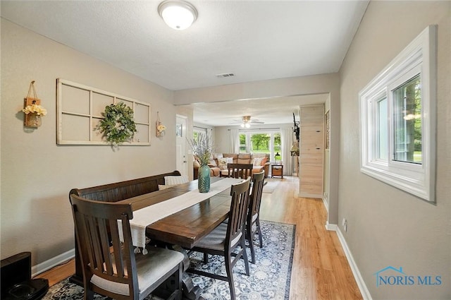 9544 Maumee Western Rd, Monclova, OH 43542 - dining area with light wood-type flooring, baseboards, and a ceiling fan