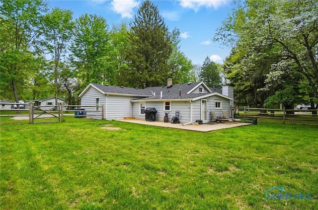 9544 Maumee Western Rd, Monclova, OH 43542 - back of house with a chimney, a patio area, a gate, and view of wooded area