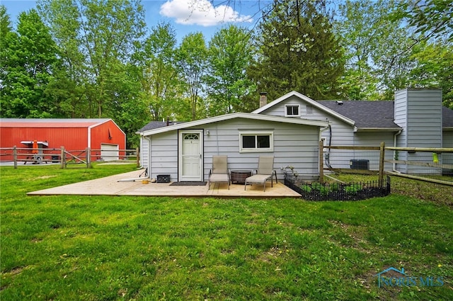 9544 Maumee Western Rd, Monclova, OH 43542 - back of property featuring a chimney, a patio area, and central air condition unit