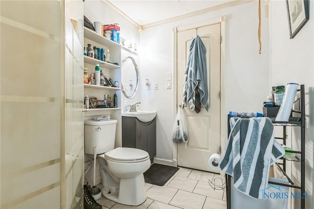 6690 County Road 219, Bellevue, OH 44811 - bathroom featuring toilet, ornamental molding, and tile patterned flooring