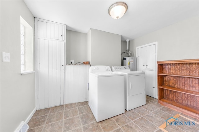 21 Pennsylvania Ave, Waterville, OH 43566 - laundry room featuring washer and clothes dryer and water heater