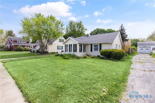 21 Pennsylvania Ave, Waterville, OH 43566 - view of front of home with a front lawn, a chimney, and a shingled roof