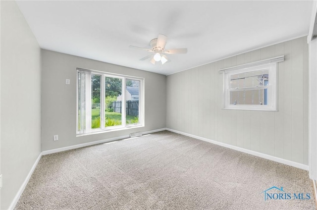 21 Pennsylvania Ave, Waterville, OH 43566 - spare room featuring carpet flooring, a ceiling fan, and baseboards